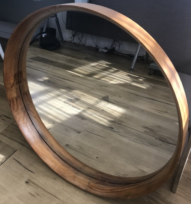 Yarrabah Round Mirror 80cms round Pine Wood. II is a perfect circle of glass encompassed by a solid wood frame with narrow edging